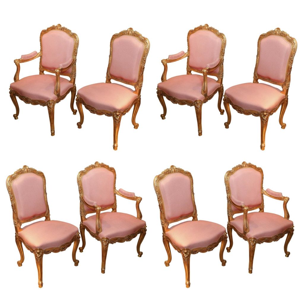 Set of Eight French Louis XV Style Giltwood Dining Chairs, highly carved